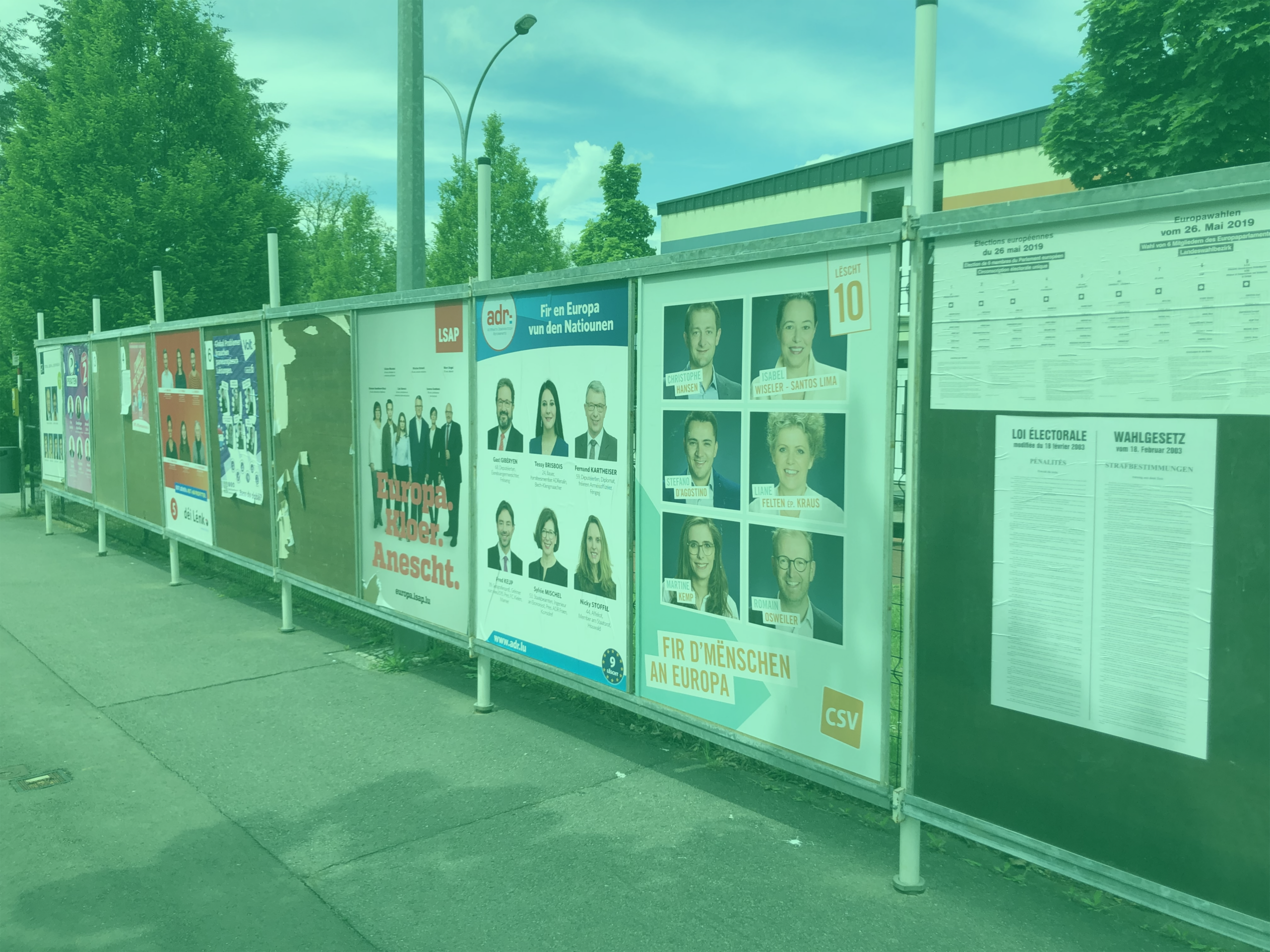 Photo: "Election posters for EU Parliament election in Luxembourg, various", by Bdx, licensed under CC BY-SA 4.0. Hue modified from the original