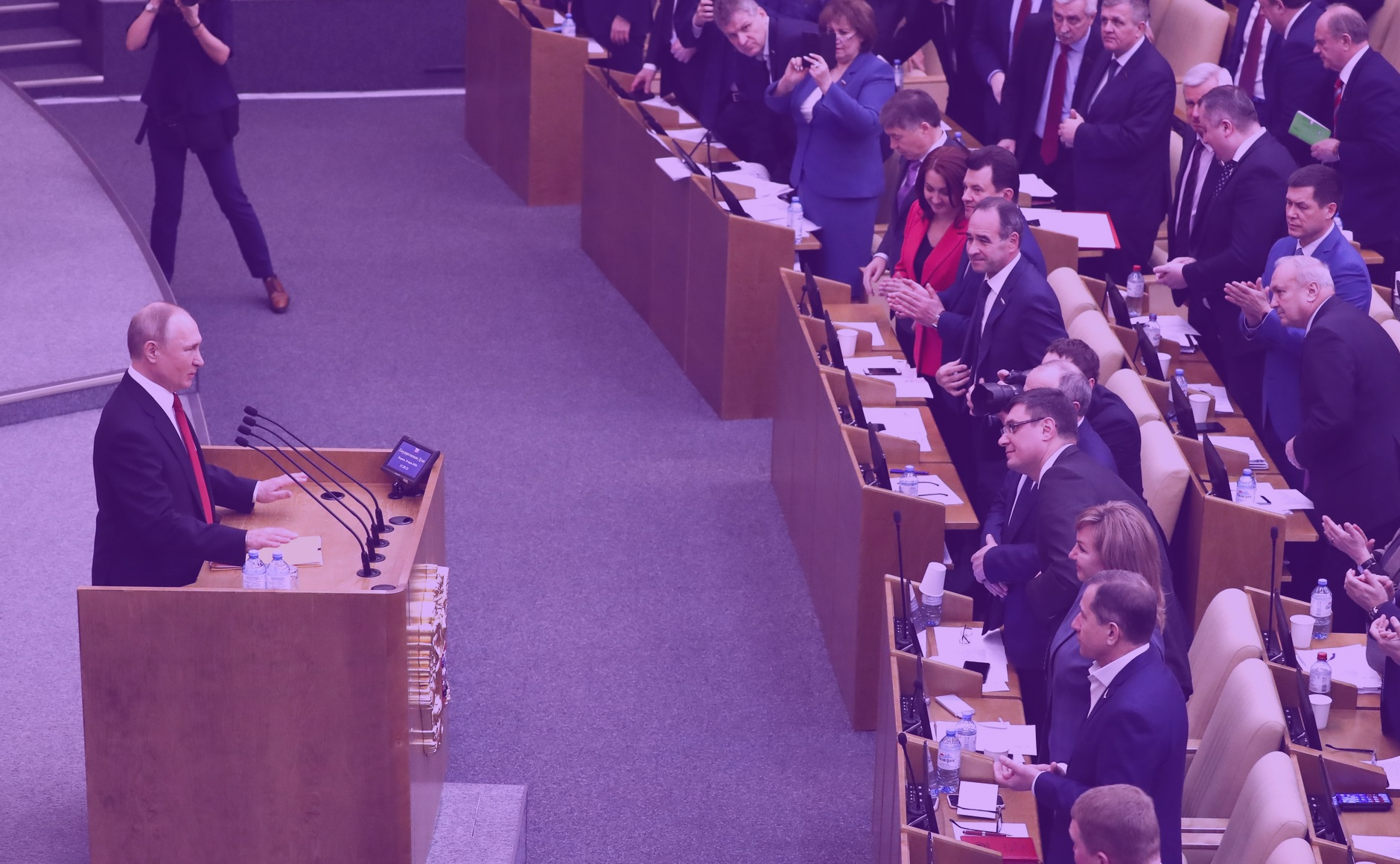 Photo: "Vladimir Putin Speech at State Duma plenary session 2020-03-10 03", by The Presidential Press and Information Office, licensed under CC BY 4.0. Hue modified from the original