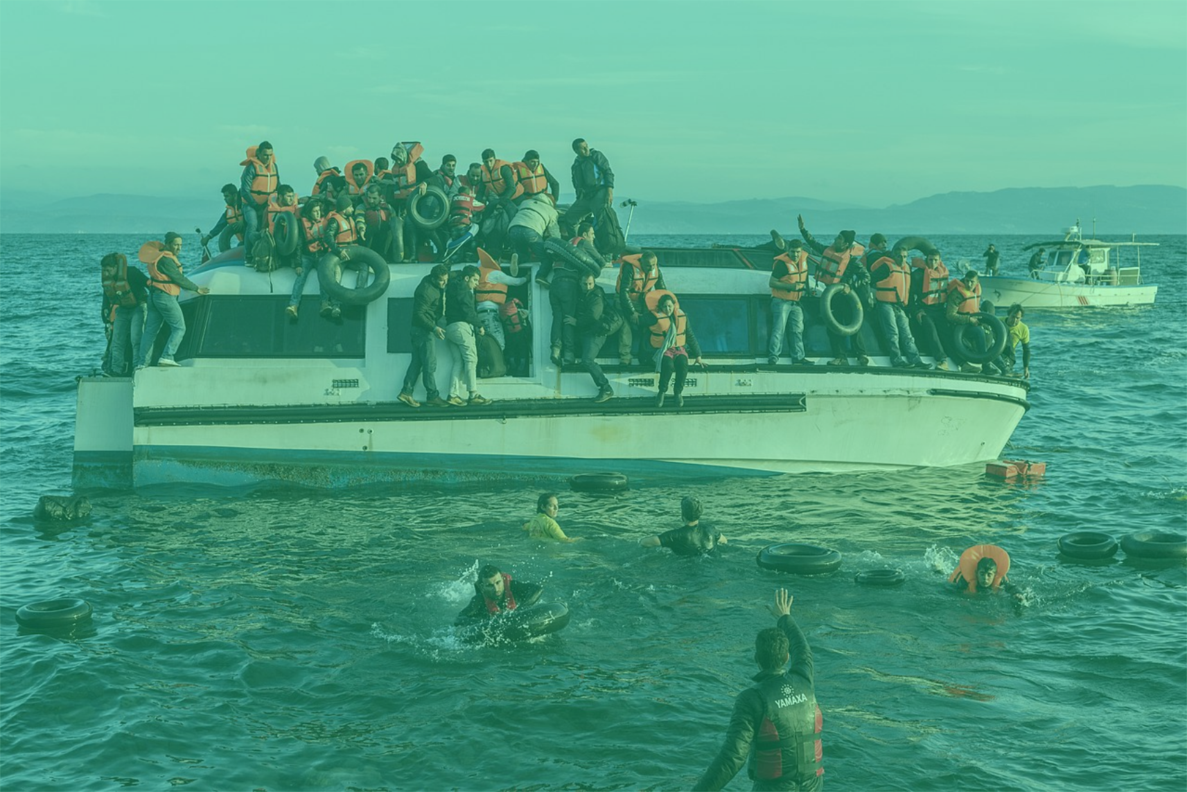 Photo: "20151030 Syrians and Iraq refugees arrive at Skala Sykamias Lesvos Greece 2", by Ggia licensed under CC BY-SA 4.0. Hue modified from the original