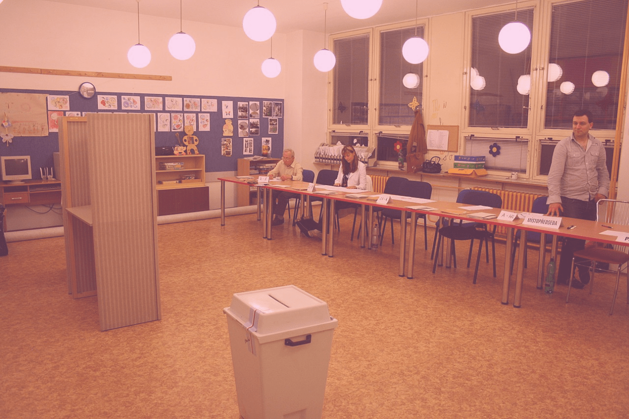 Photo: "Polling station for 2010 czech legislative election in Třebíč, Třebíč District", by Jiří Sedláček - Frettie licensed under CC BY-SA 3.0. Hue modified from the original