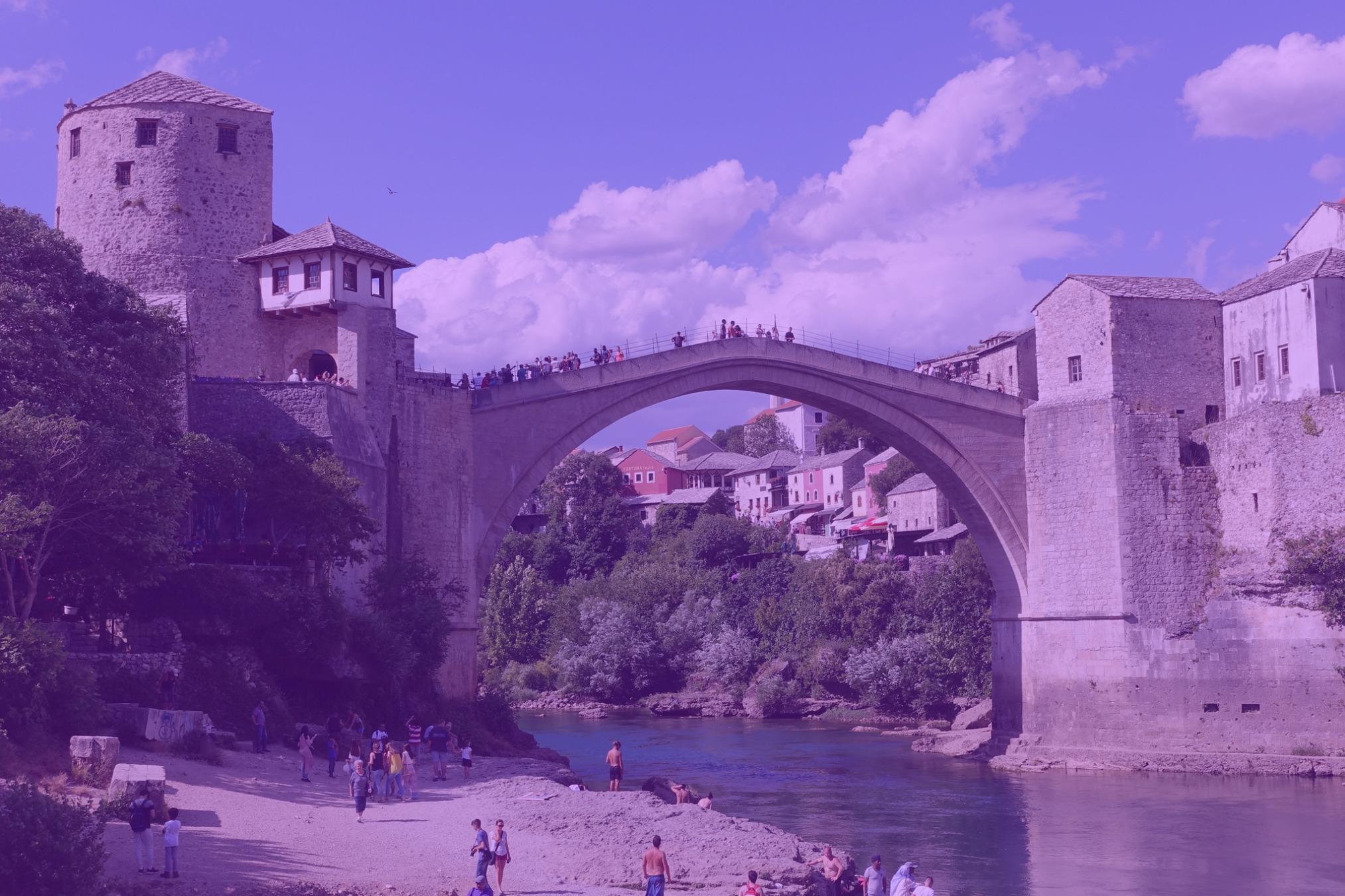 Photo: "Stari Most, Mostar", by David Jones licensed under CC BY 2.0. Hue modified from the original